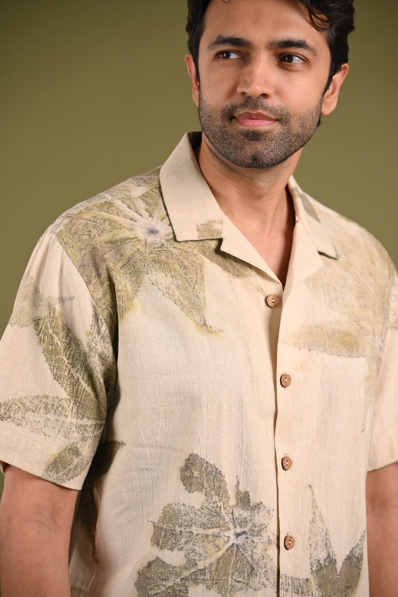 Close-up of the Gia Shirt’s eco-printed castor leaf patterns, showcasing the natural textures and handcrafted beauty of Kala Cotton.