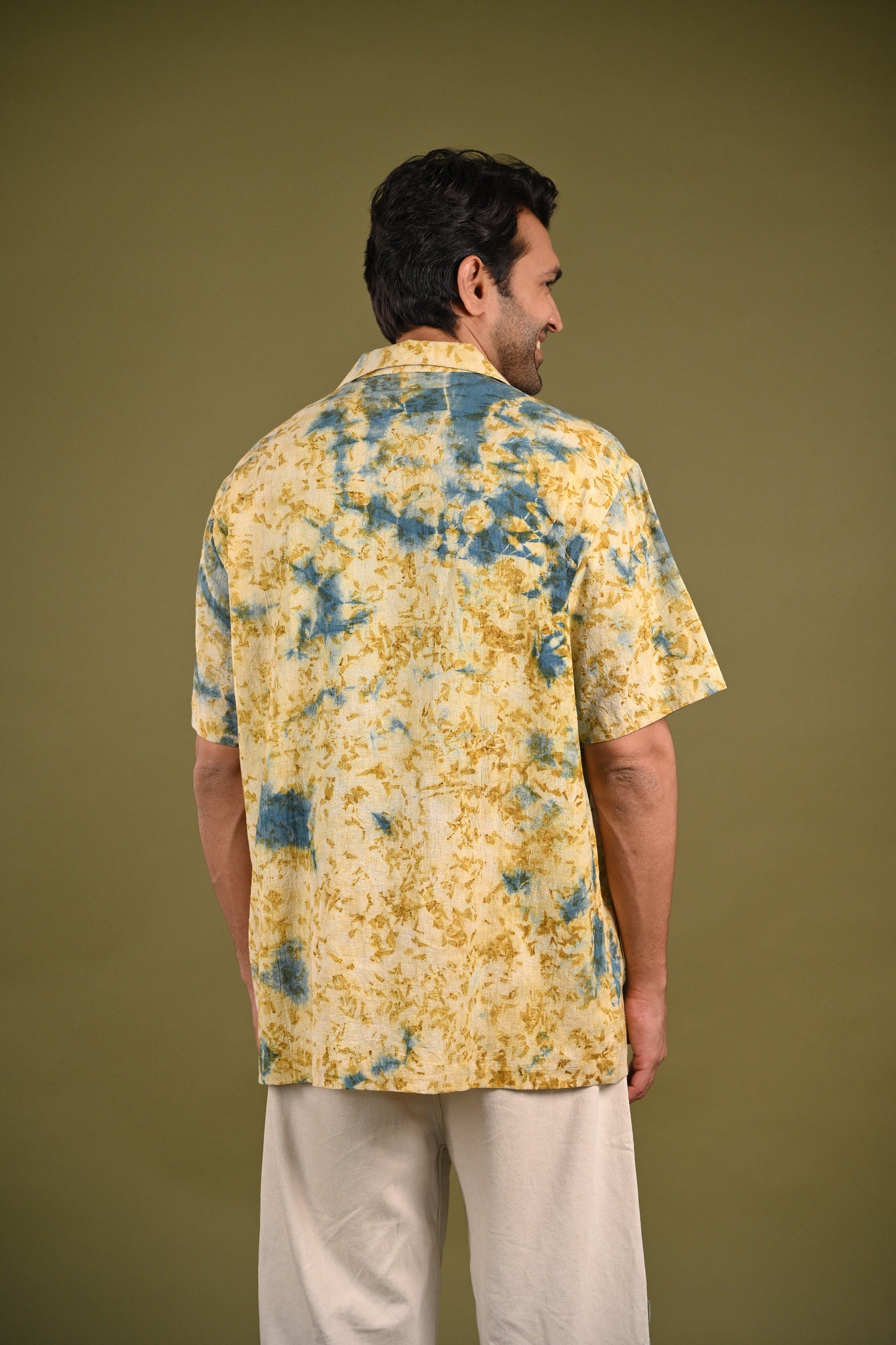 Back view of the Aayah Shirt, featuring subtle Indigo and marigold petal eco-prints on breathable, handwoven Kala Cotton, embracing slow fashion.