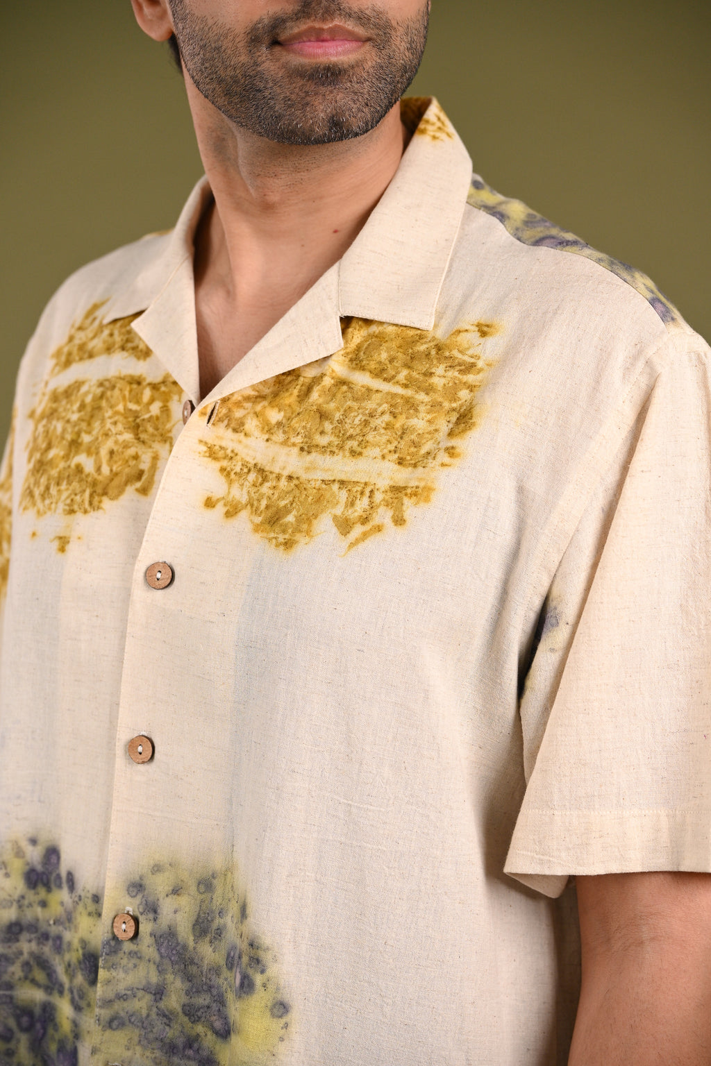Close-up of the Ehsal Shirt’s eco-printed marigold and rose petal design, showcasing the organic textures and botanical imprints on handwoven cotton.
