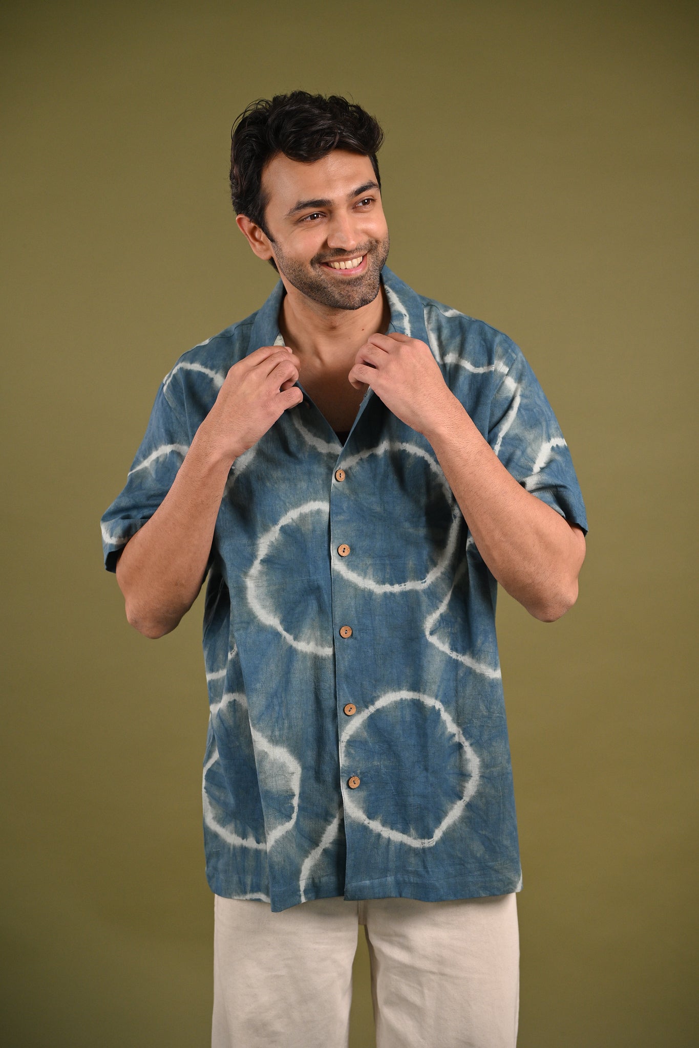 Nilima Shirt – A slow fashion piece featuring intricate Shibori patterns in natural indigo on breathable, handwoven cotton, blending tradition with contemporary style.