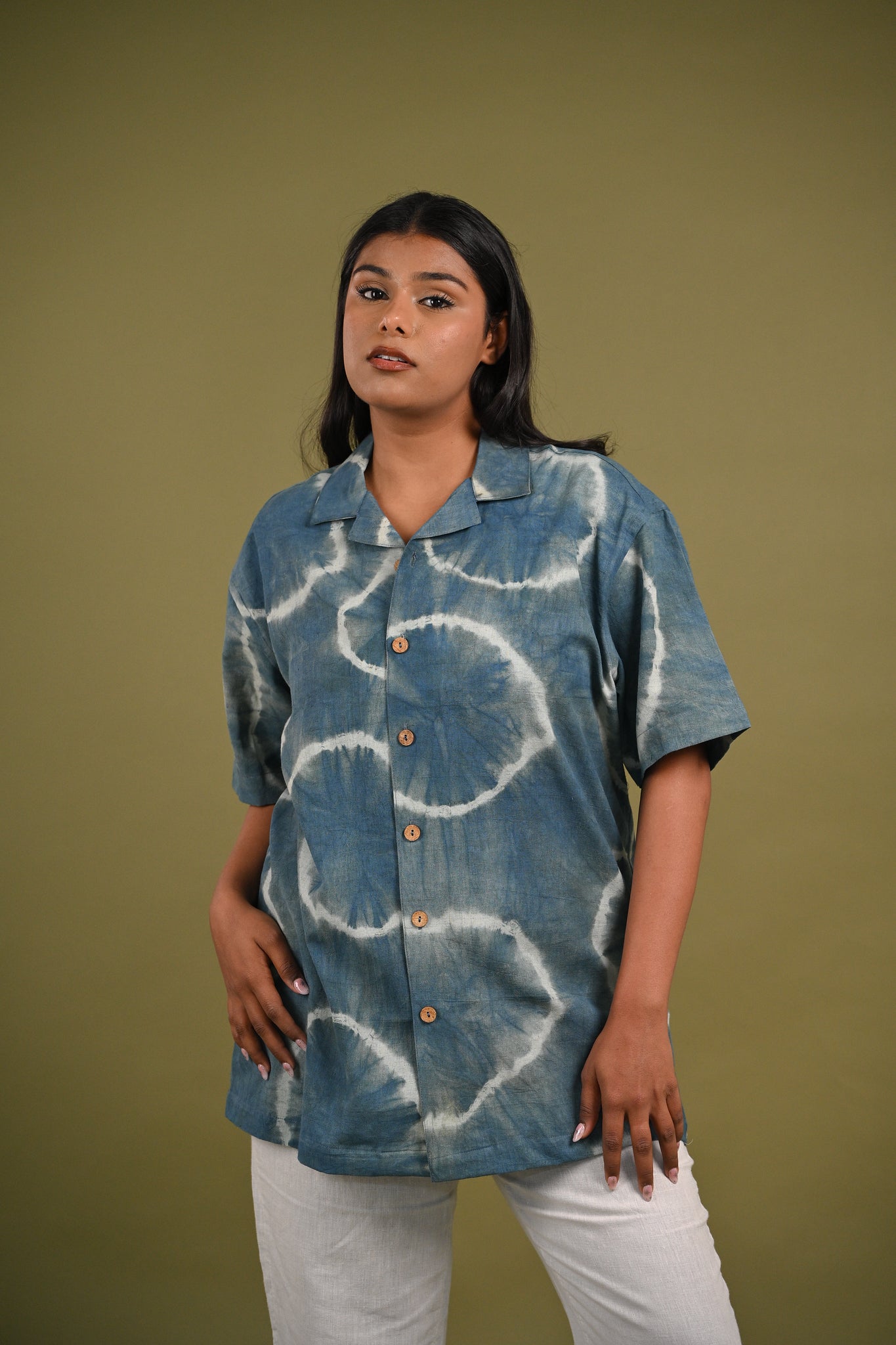 Model wearing the Nilima Shirt, showcasing its relaxed fit and handcrafted Shibori indigo patterns, perfect for effortless, sustainable fashion.