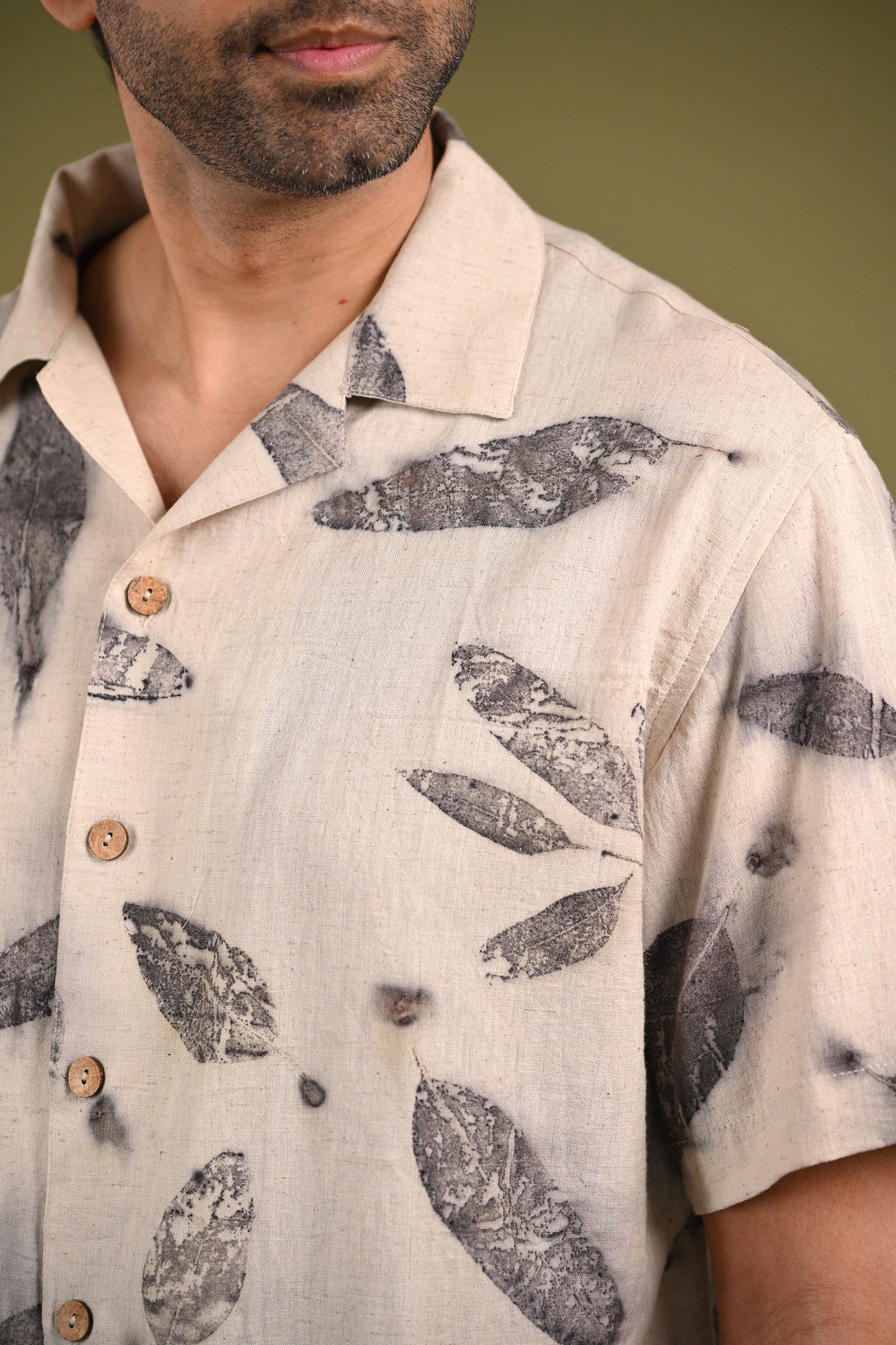 Close-up of the Emma Shirt’s eco-printed eucalyptus leaf patterns, showcasing the organic textures and natural beauty of handwoven cotton.