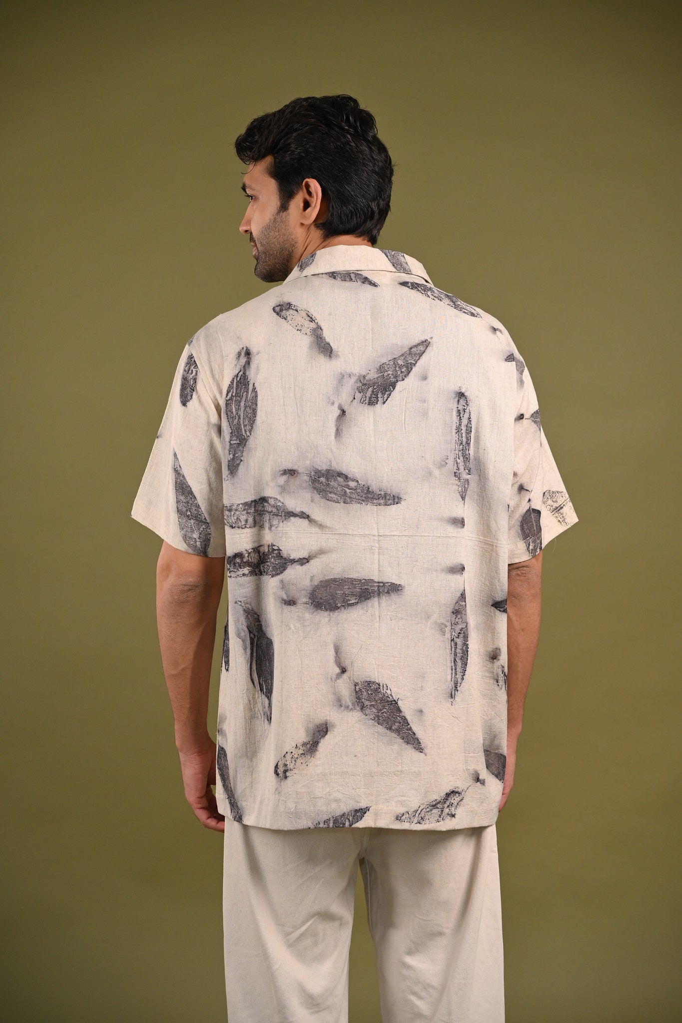 Back view of the Emma Shirt, featuring a minimalist design with delicate eucalyptus eco-prints on soft, handspun cotton, reflecting slow fashion principles.