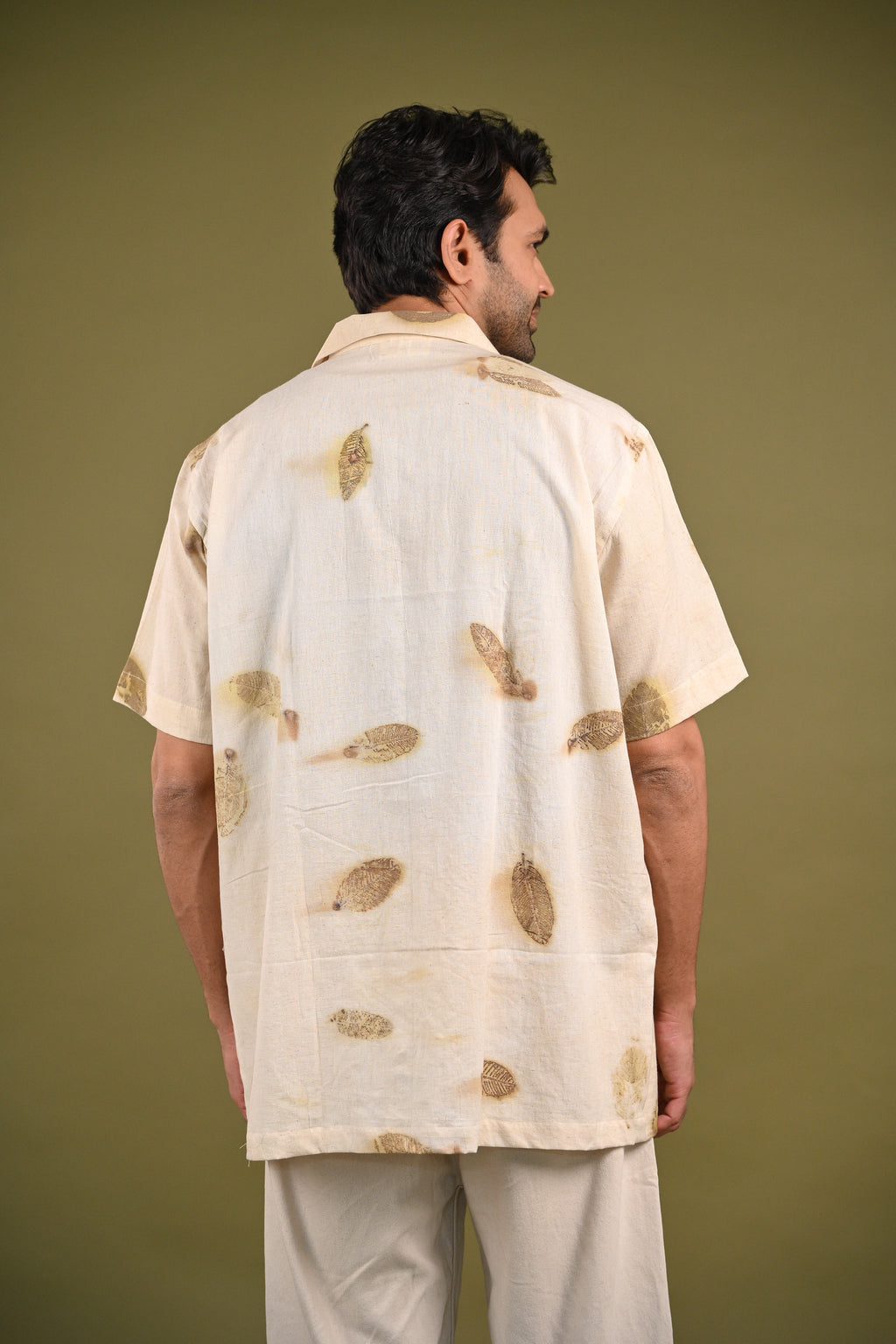 Back view of the Peru Shirt with a seamless finish and handwoven cotton texture.