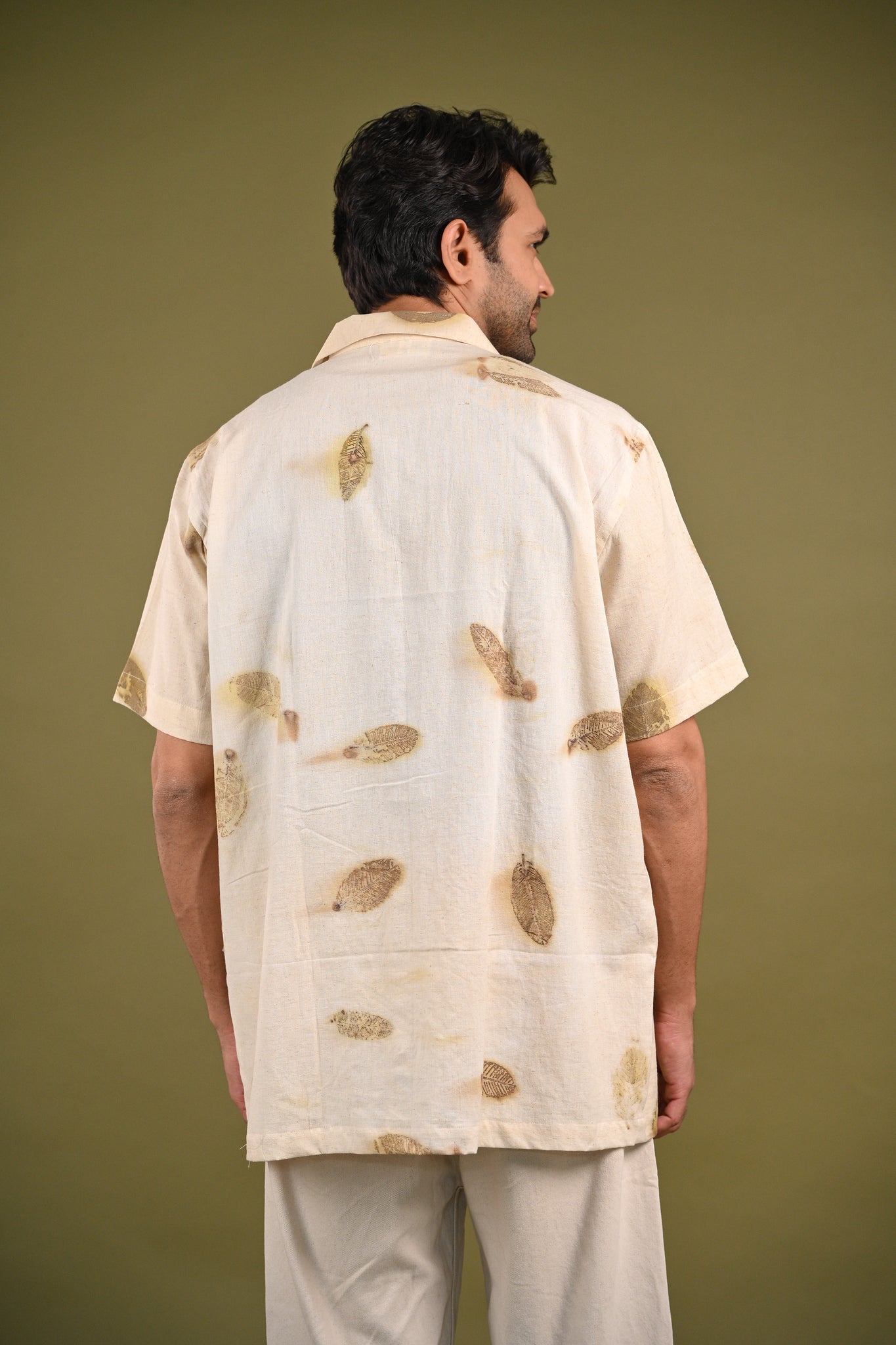 Back view of the Peru Shirt with a seamless finish and handwoven cotton texture.